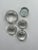 Set of 5 clear glass paperweights, 4 are convex, and one is a flat blown glass paperweight. Largest measures 4 x 4 x 1,...