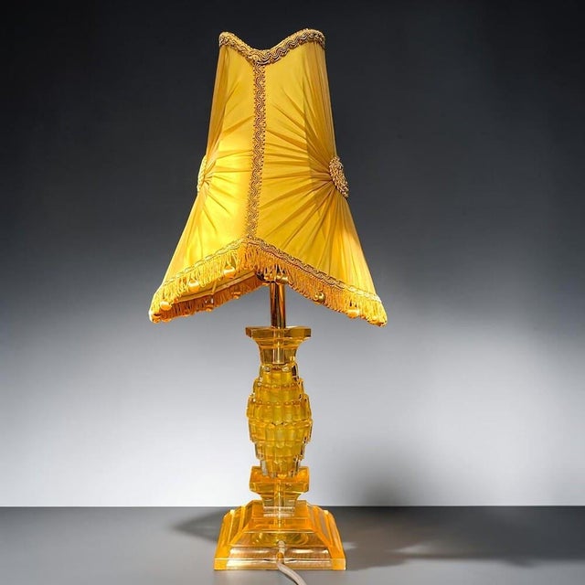 Unusual vintage amber acrylic glass table lamp, most likely dating from the 1960s–1970s, combining a highly decorative...