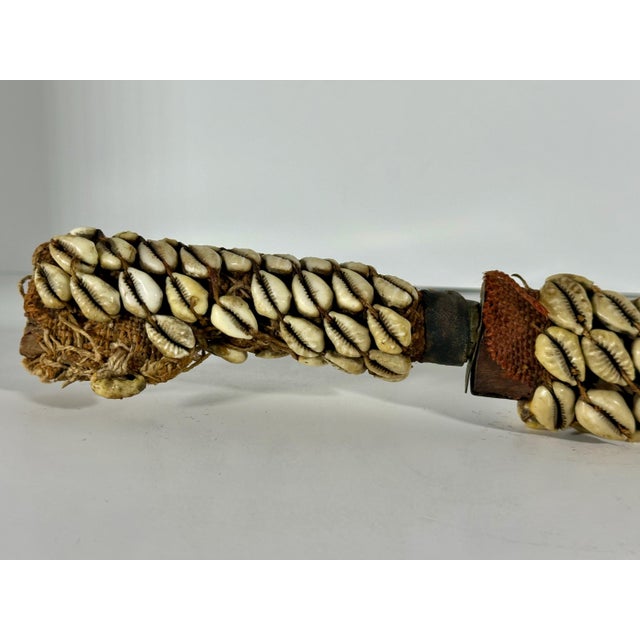 North African Kabyle Berber Flyssa Dagger with Cowrie Decoration for your consideration. The sheathed dagger is long,...