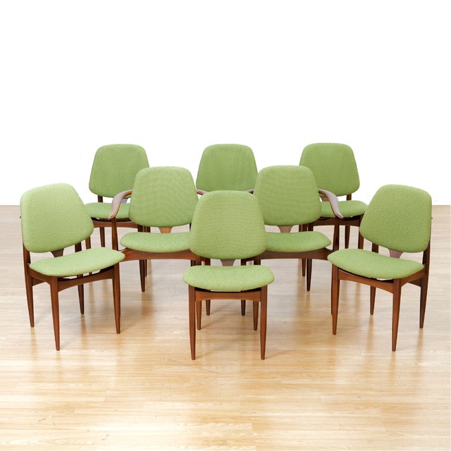 This stunning set of eight dining chairs were designed and produced by 'Elliotts of Newbury' of Berkshire, England during...