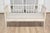 A Swedish Gustavian style gray painted sofa bench from the 20th century with high back, raised diamond motifs and linen...