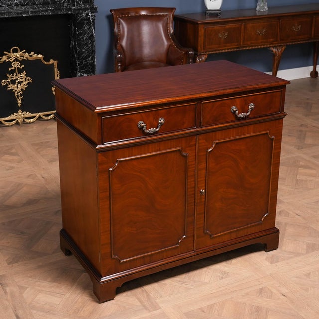 This Mahogany Two Door Server from Niagara Furniture has a great amount of storage space with two full doors below opening...