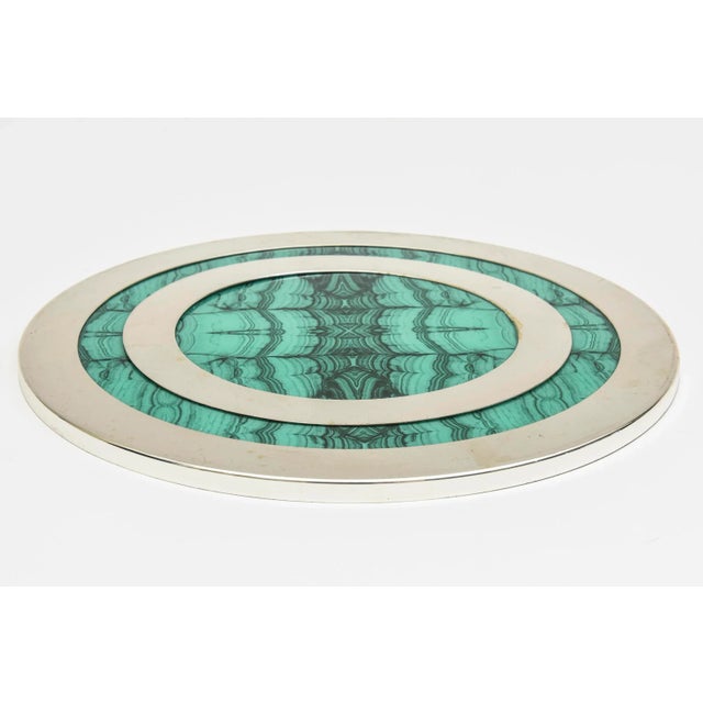 This lovely vintage malachite and chrome flat round tray is perfect barware and serving. The back is wood. From the 70's....