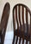 A set of 4 beautiful oak chairs in a dark stain and in excellent vintage condition. Arched top with vertical slats that...