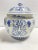 A beautifully scaled vintage blue and white porcelain lidded jar featuring traditional geometric and botanical motifs in...