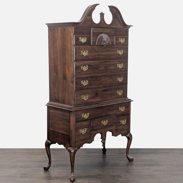 This Pennsylvania House highboy dresser offers classic style and solid wood construction. Features include elegant brass...