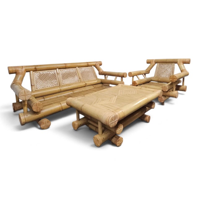 This monumental 3-piece jumbo bamboo lounge set epitomizes the raw, geometric power of the late-20th-century "Tropical...