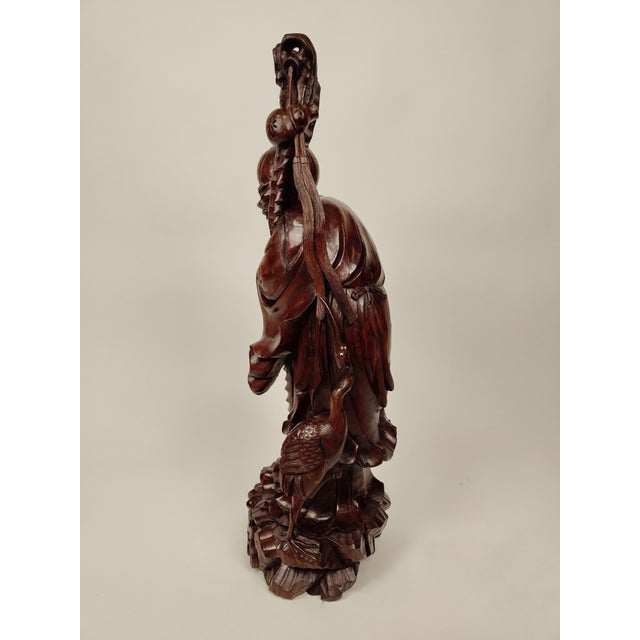 This teak wood sculpture represents a sage made in the Chinese craft tradition at the end of the 19th century: circa 1890....