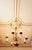 The chandelier is made of patinated brass. The top is decorated with a Flemish eagle. The chandelier is for eight classic...
