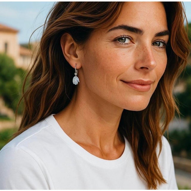 Gracefully blending meaningful symbolism with refined luxury, these exquisite 14K White Gold Lever Back earrings feature...