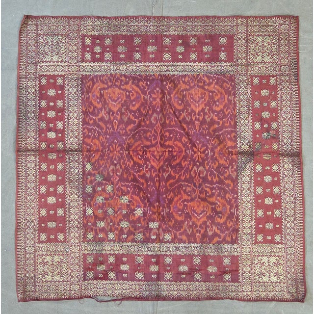 A highly collectible antique early 20th century hand-woven silk ikat songket head cloth with gold thread embroidery from...