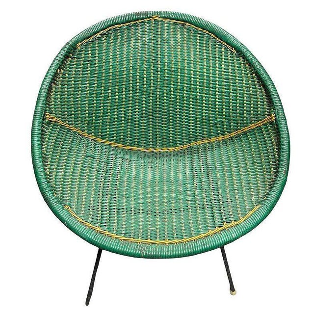 This mid-century outdoor chair, styled after Sam Avedon’s designs, features a vibrant green woven nylon seat with bold...
