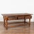 Dark walnut console table just under 7' long with three drawers resting on turned legs and stretcher base. Note the deep...