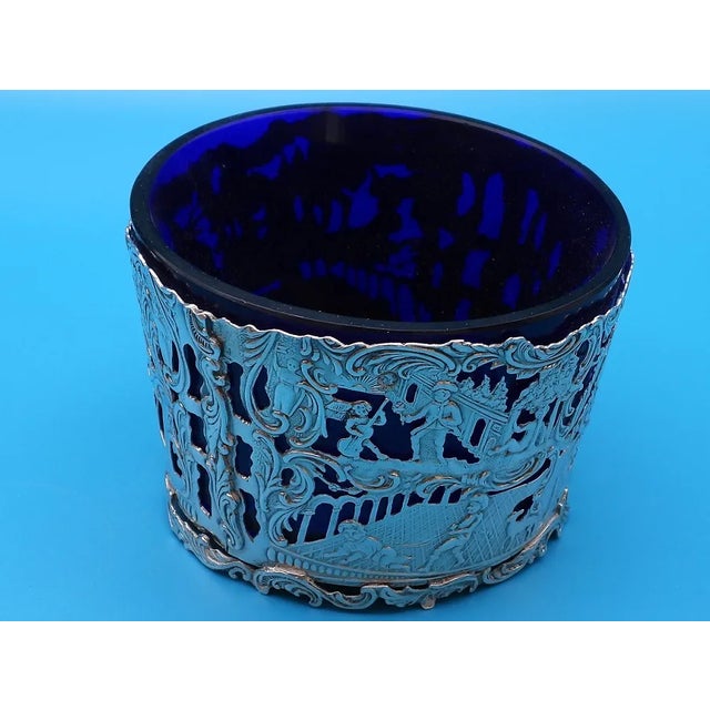 This fabulous pair of 1890 open salt cellars are created in gorgeous .833 Dutch silver and cobalt blue glass liners. The...