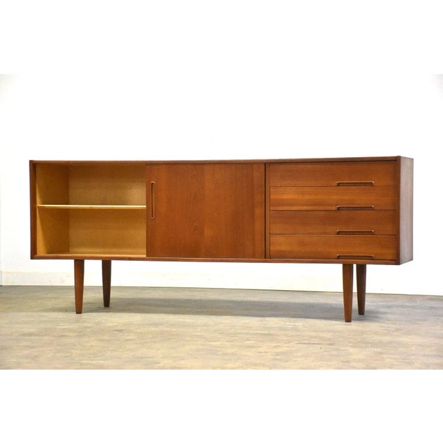 A mid century modern teak sideboard credenza designed by Nils Jonsson for Troeds. Made in Sweden. Professionally...
