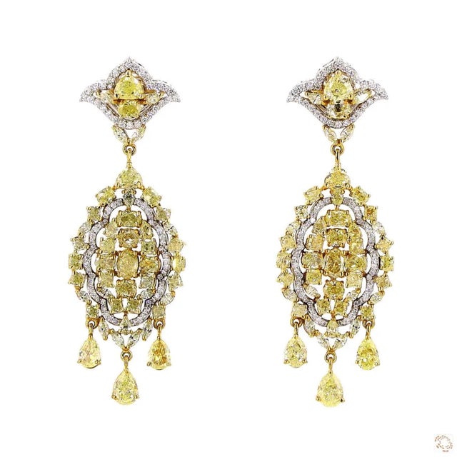 This pair of estate earrings from our contemporary estate collection centers on a 0.87-carat diamond in a round brilliant...