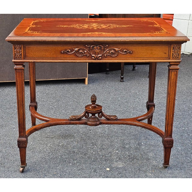 About An Italian Louis XVI revival Center table, likely dating from the third quarter of 19th century. It is characterized...