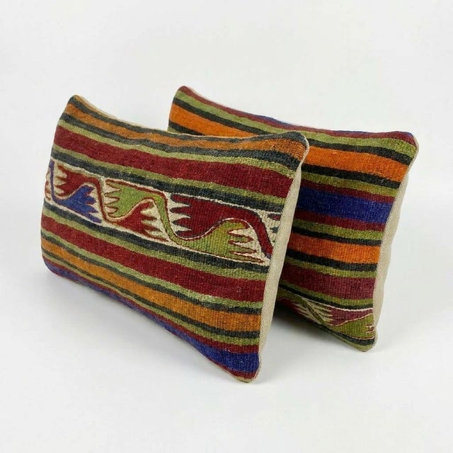 This beautiful 11'' x 23'' & 12'' x 23'' hand-woven Kilim pillow cover set was made from authentic Turkish kilim. The...