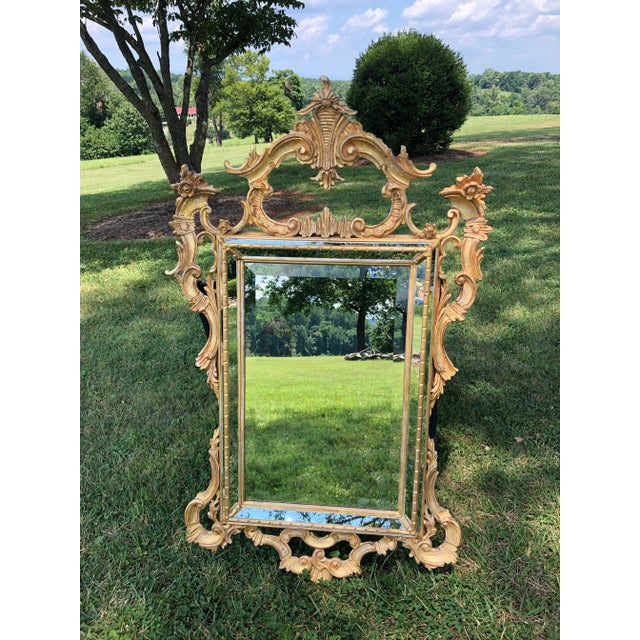 Italian Rococo gilded mirror by La Barge. Hand-carved wood and gold-leafed. An essential compliment for a classical...