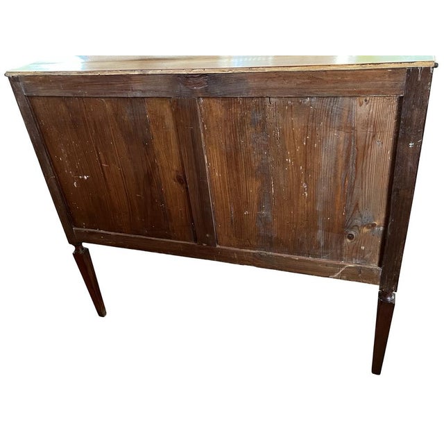 Louis XVI commode hand-made in Portugal in the early 1800s using mahogany and decorated with mahogany and fruitwood...