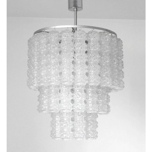 Vintage Italian chandelier with clear Murano glass tubes made in Rostrato technique hanging from silver painted metal...