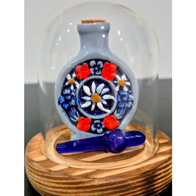 A characterful mid‑century German snuff bottle in salt‑glazed stoneware, molded with “Zwiefacher Schmalzlerfranzl”...