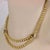This is a lovely vintage necklace, it is crafted from 18k yellow gold with a high polished finish and features fluted 6mm...