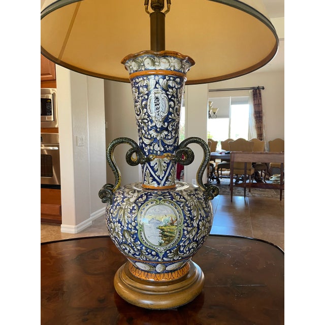 This majolica is a conversation piece! It is a large urn vase turned into a lamp. It is an antique from the Italian...