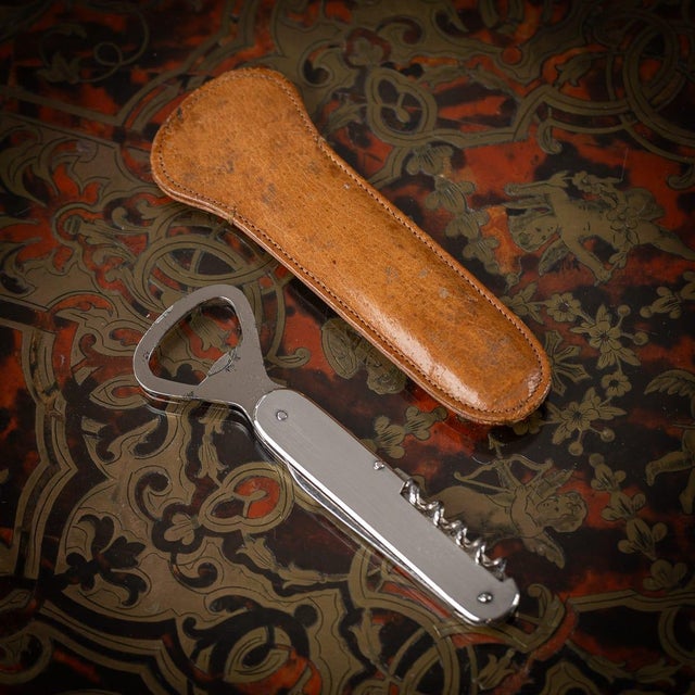 A superb 20th century english solid silver "barman’s friend" combination tool consisting of a bottle opener, corkscrew and...