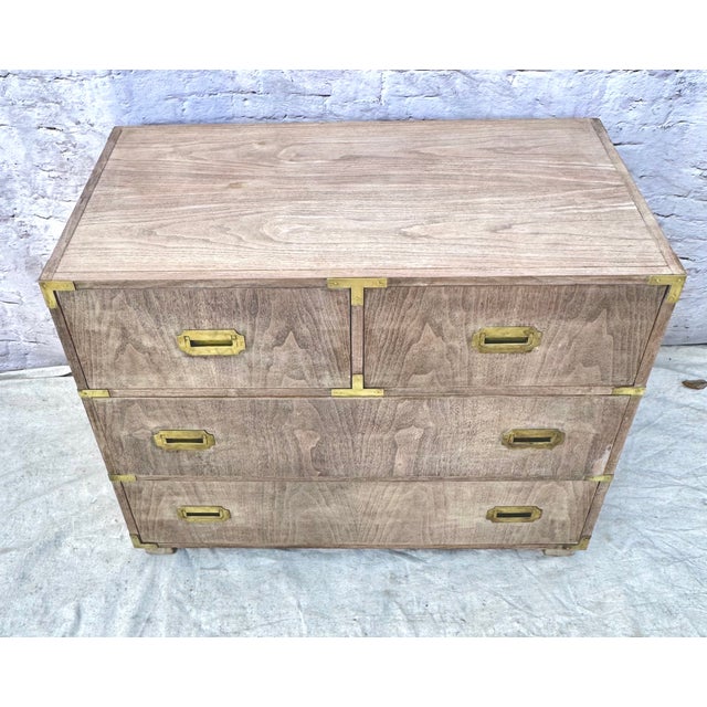 Beautiful pair of Baker Company mid-century modern bleached mahogany four drawer chests with brass inset handles. Baker...