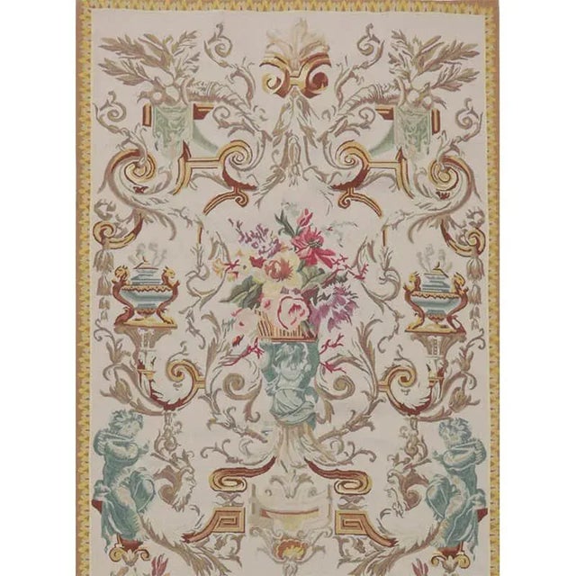 Handwoven vertical tapestry recreation with cherubs and floral bouquets on an ivory background. Hand-woven with a wool...