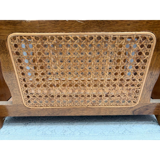 Midcentury wood and cane curvy magazine rack or vessel for files. Warm brown and tan with curvy handle and side knobs....