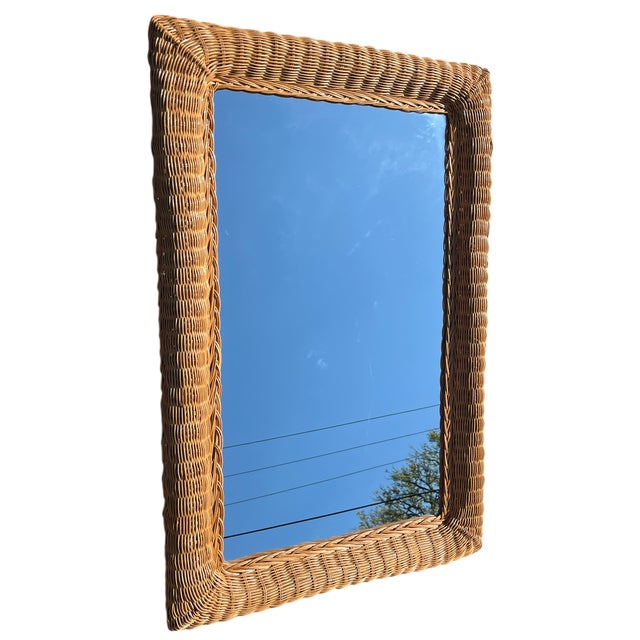 A beautifully scaled vintage wall mirror wrapped in richly textured, hand-woven wicker—an effortless statement piece that...