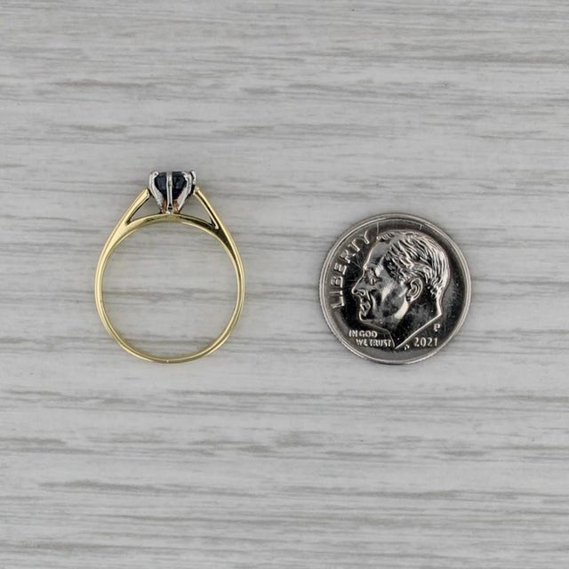 Gemstone Information: - Natural Sapphire - Carats - 0.50ct Cut - Round Color - Dark Blue Treatment - Heated Metal: 18k...