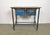 Vintage Industrial worktable from the 1960s. It features an iron construction, a solid wooden plate and two iron drawers....