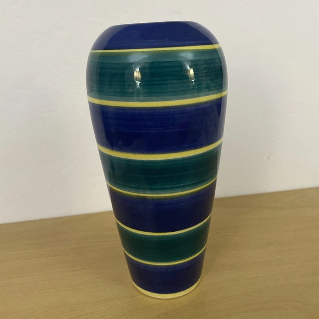 Add a vibrant touch of European craftsmanship to your home with this beautiful vintage RC Ceramic hand-painted vase,...