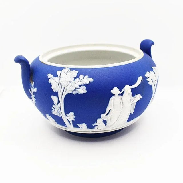 A stunning Neoclassical Wedgwood Portland Blue bowl with a white overlay. This piece is believed to have been a small...
