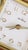 A handsome vintage Seth Thomas mechanical travel alarm clock housed in its original compact folding case. The reddish-...