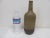 Brown on brown glazed bottle shaped vase. Unusual shape. Rorstrand 3 crown emblem, G.N. and SWEDEN on the bottom. The base...