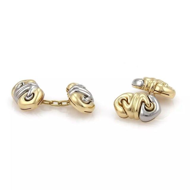 This is a lovely pair of authentic cufflinks by Bvlgari from the DOPPIO CUORE collection. They are crafted from 18k yellwo...