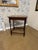 Such a lovely piece of history, this side table features distinctive legs and a delicate scalloped top. This would be a...