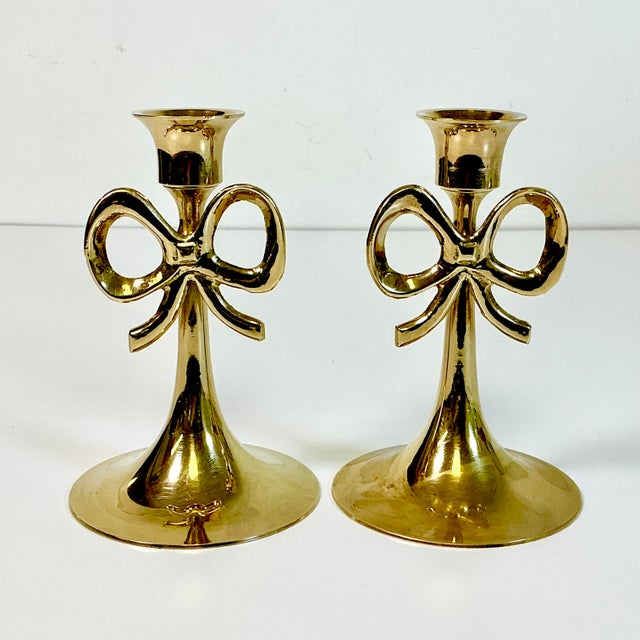 Vintage Home is pleased to offer this pair of Chippendale style Brass Bow Candlestick Holders. The early Mid-Century pair...