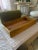 A beautifully crafted large vintage wooden serving tray, featuring a warm honey-toned finish and a striking natural wood...