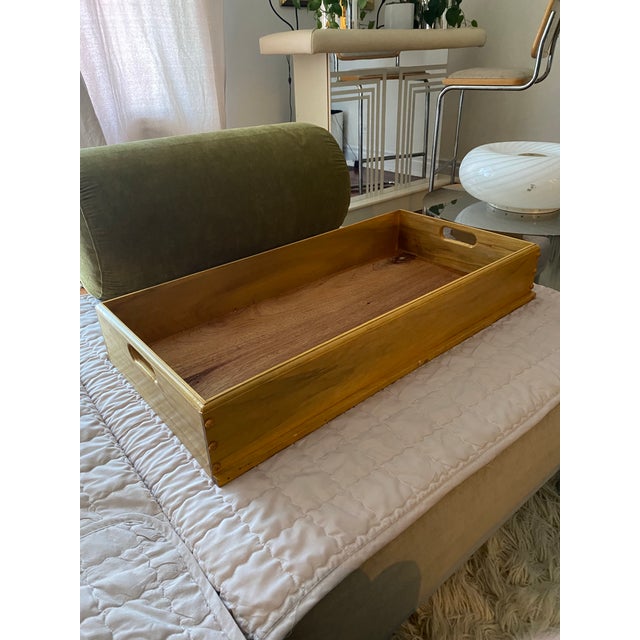 A beautifully crafted large vintage wooden serving tray, featuring a warm honey-toned finish and a striking natural wood...
