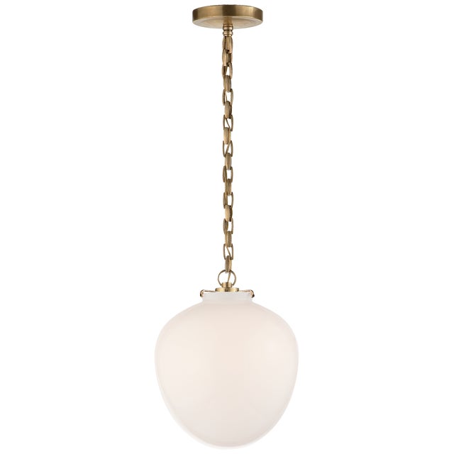Katie Acorn Pendant in Hand-Rubbed Antique Brass with White Glass Designer: Thomas O'Brien Canopy: 5.25" Round Mounting:...