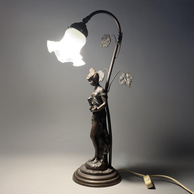 A rare and highly valuable lighting piece from France. This imposing sculptural table lamp, crafted in the Art Nouveau...