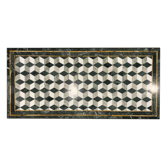 A fabulous cocktail table with patterned marble top, a geometric mosaic of green, gray, white, and gold tones. The...