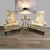 A dramatic matched pair of 1970s high-back lounge chairs attributed to Silver Craft Furniture Co., combining exaggerated...