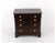 A miniature salesman sample mahogany chest of drawers in a simple, restrained American Empire style in a deep reddish-...