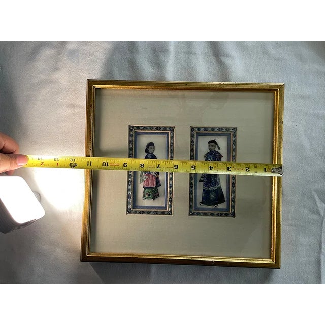 Elegant framed pair of Chinese-style portraits depicting a male and female court figure, rendered in fine detail with...